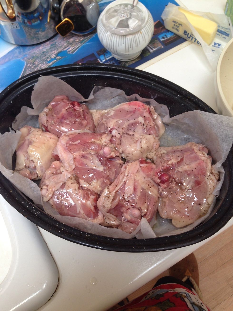 Lay the thighs skin side down in the pan.