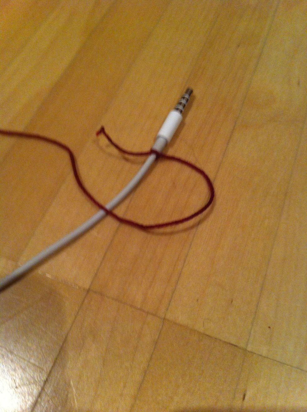 Lay the thread over the cable making a loop...