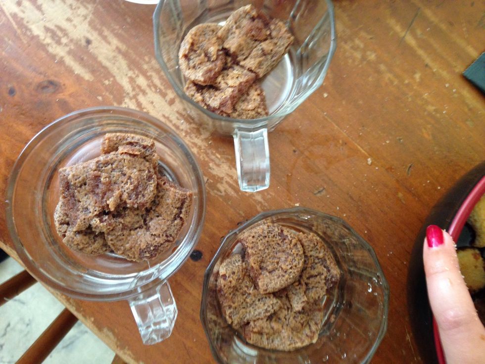 Lay them at the bottom of each glass, squeezing out excess coffee.