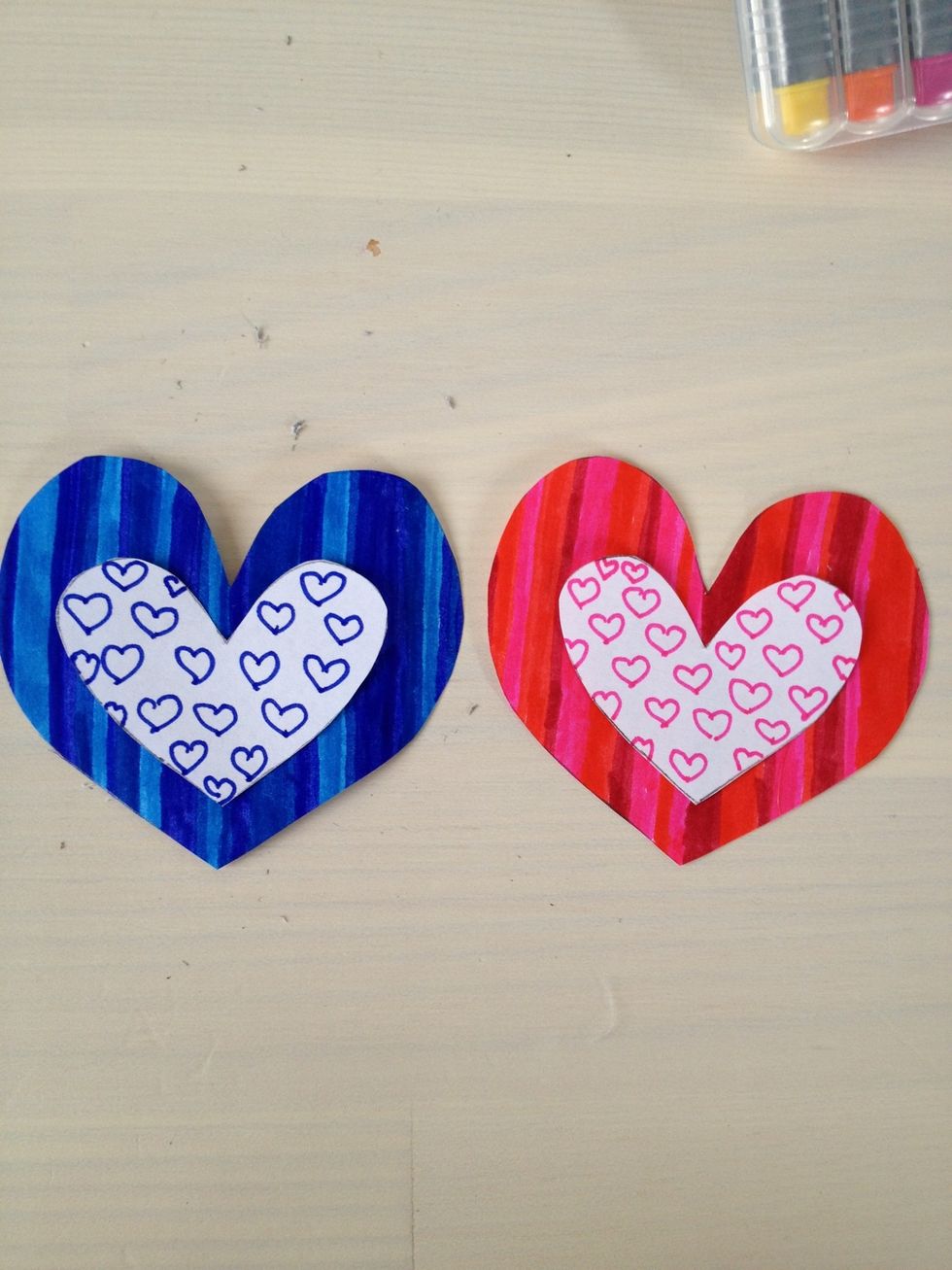 Lay them on the bigger hearts so you have an idea of where you're gonna glue them.