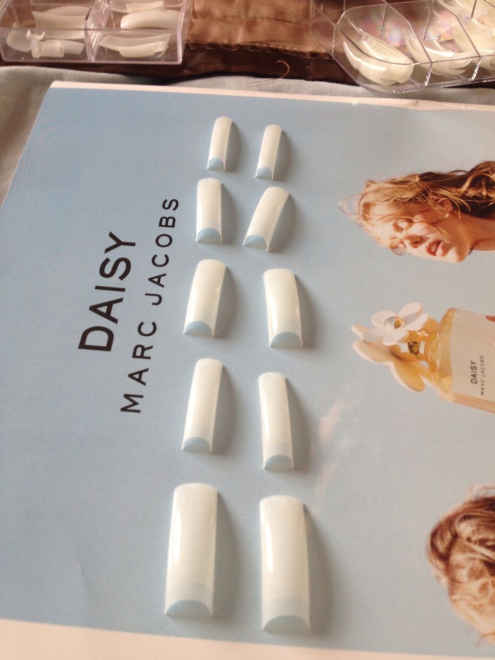 Lay them out on a flat surface, use a magazine or newspaper to work on to save any messes or stains