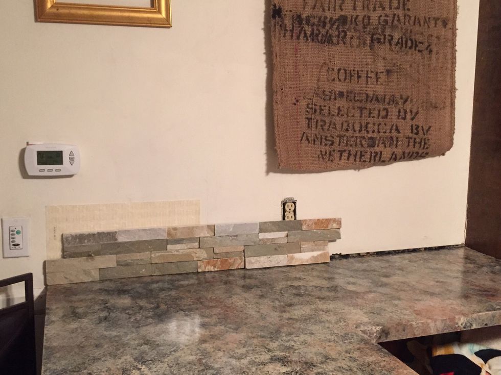 Lay tile against wall to see where you will have to make cuts.