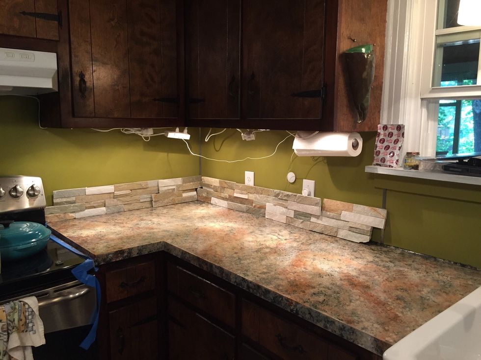 Lay tiles out. Secure tiles that don't need cutting with adhesive