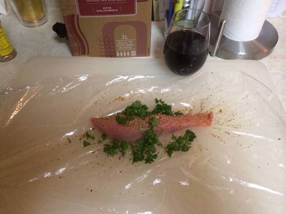 Lay turkey breast on cling film and season with whatever you like