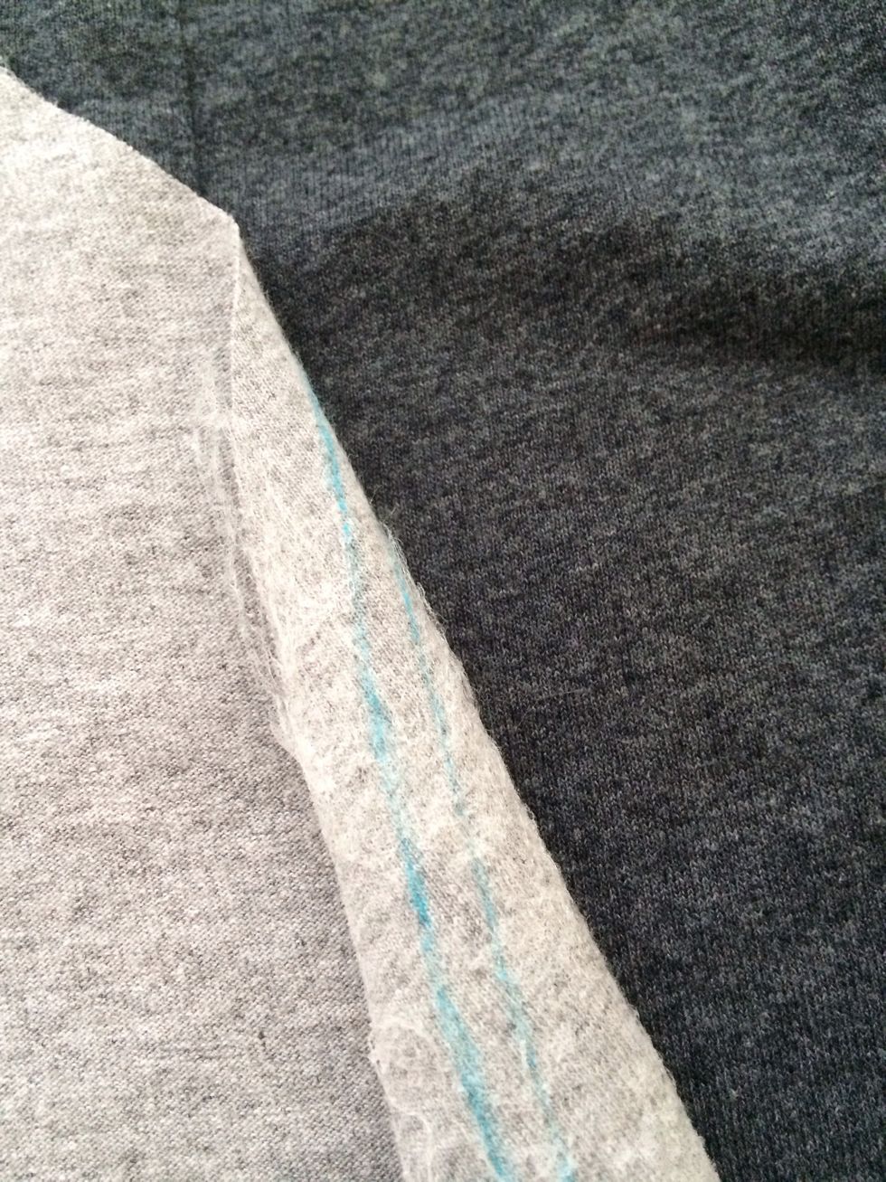 Lay your belly, adhesive side down, where you want it and iron it on according to your adhesive directions.