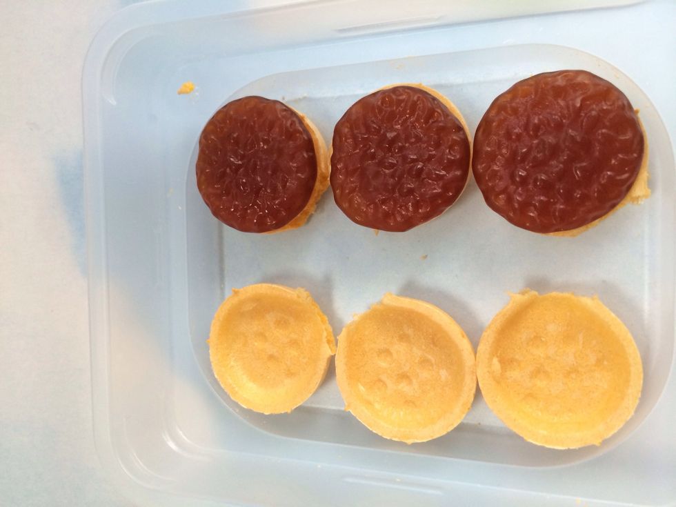 Lay your bottom wafers out and place Burger Gummies (Cola Flavor)
