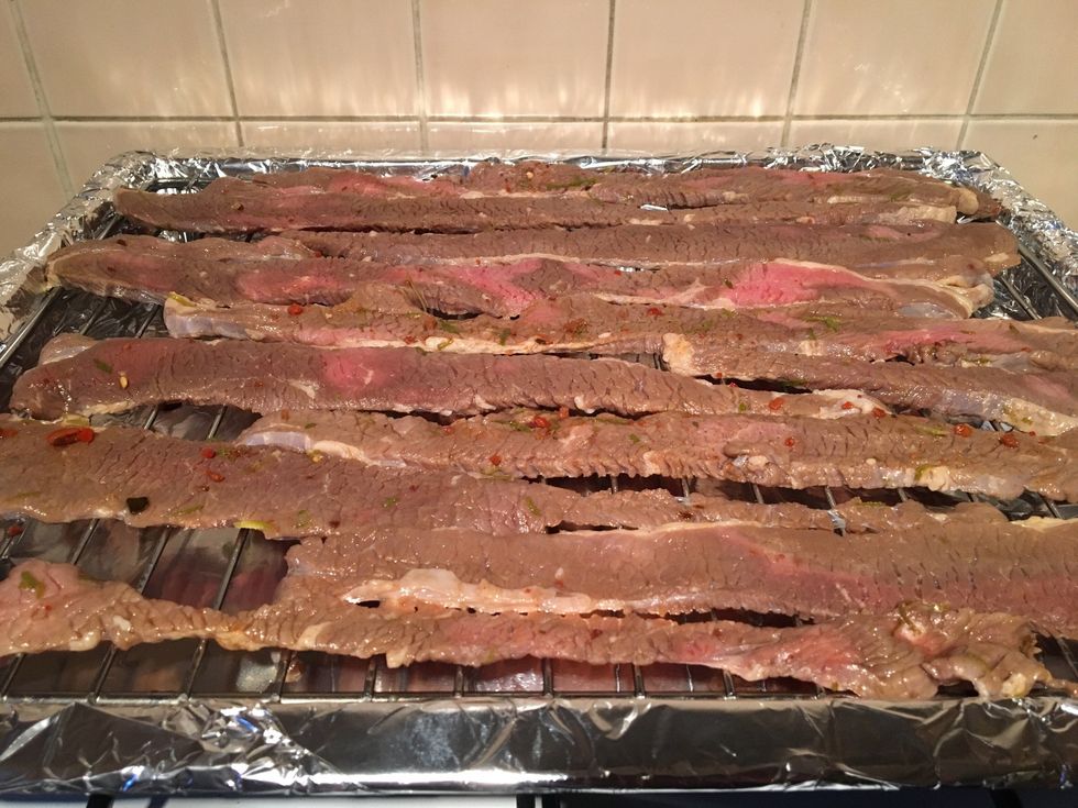 Lay your brisket out in thin strips being careful as to not have them overlay each other on a wire rack, similar you do when you cook bacon