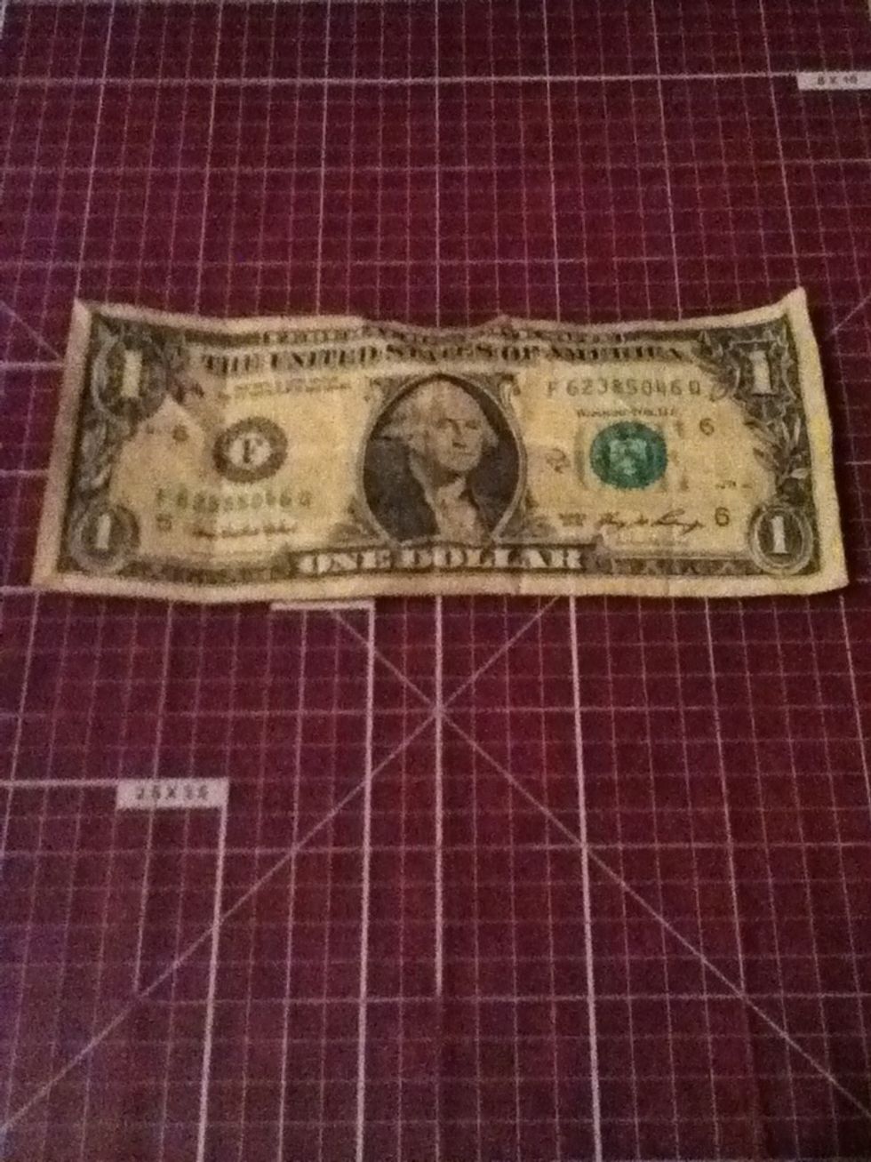 Lay your dollar out on a hard surface