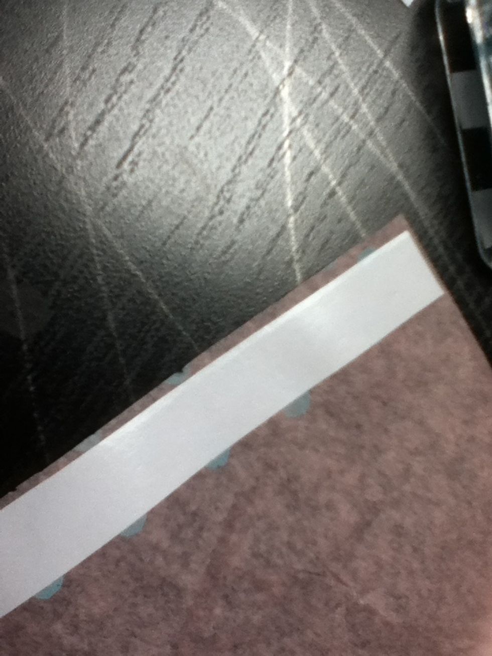 Lay your double sided tape sticky side down on the non stamped side of your tissue paper. My ink bled through, so it didn't matter for me.