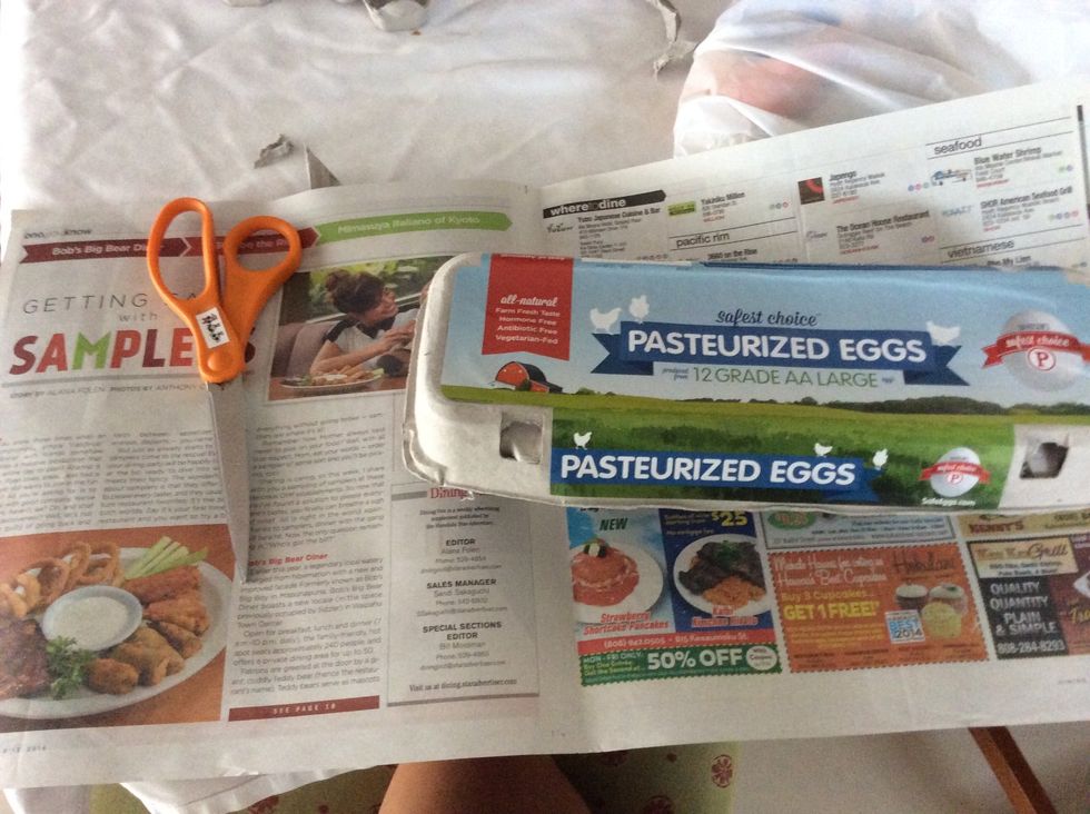 Lay your newspaper out and grab your scissors and egg carton