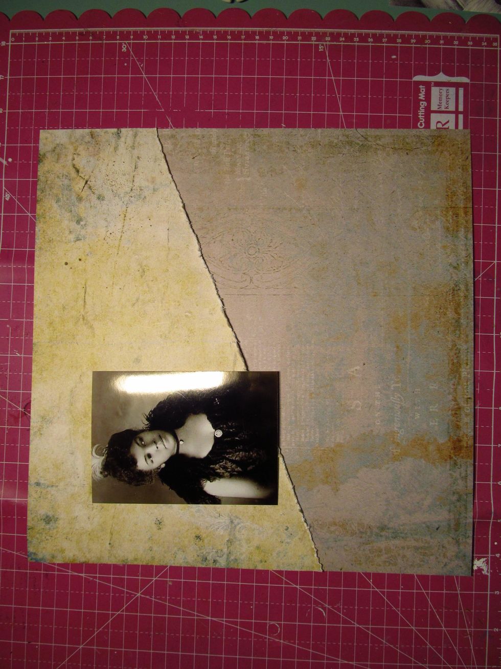 Lay your photo down and mark off your placement with a pencil. I do this so when I do some stenciling and stamping on my background, I know exactly where my photo will be.