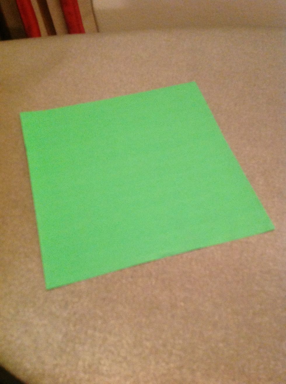 Lay your square paper flat on a hard surface
