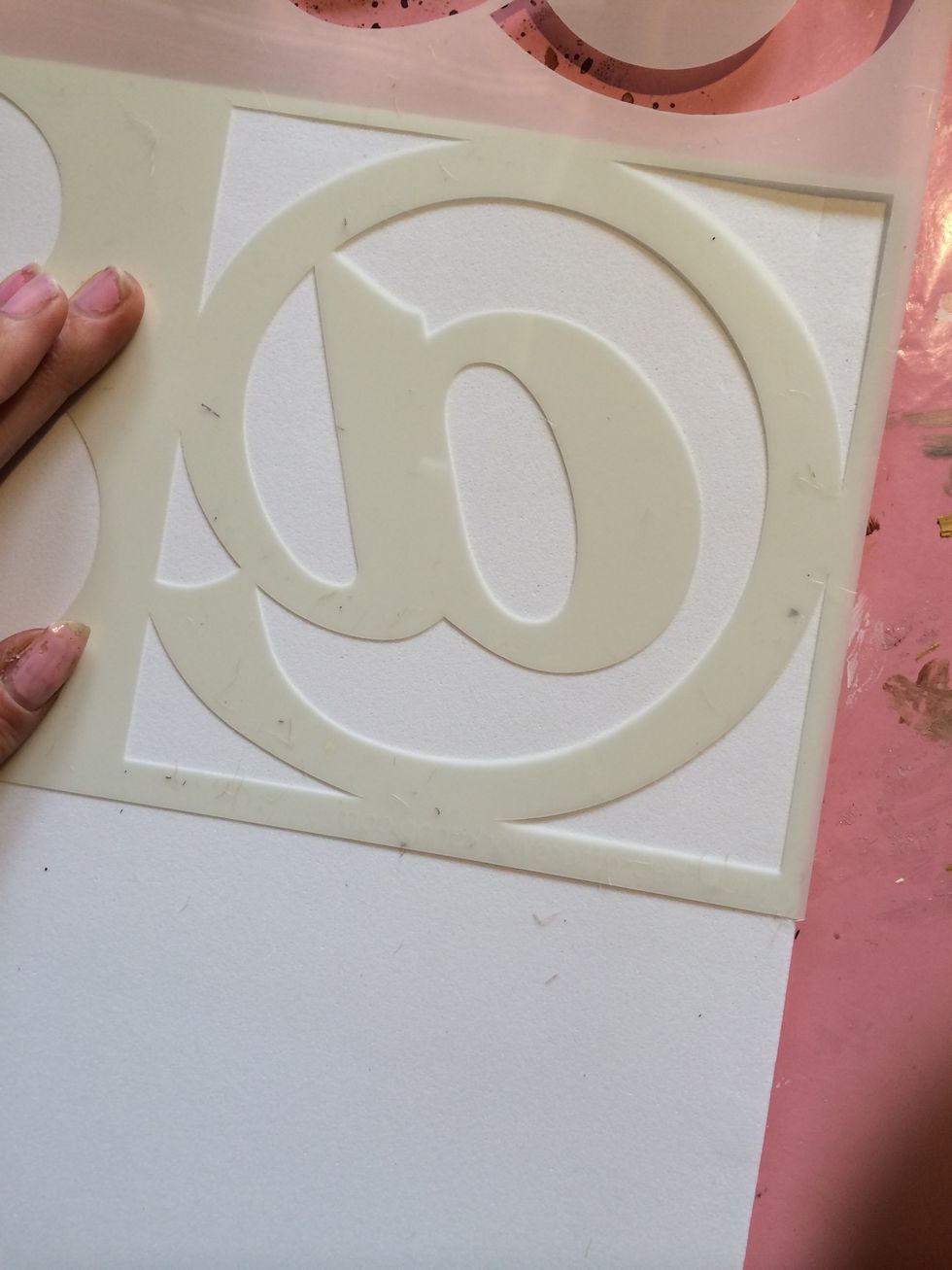Lay your stencil down. It doesn't matter which way (face up or face down.) Since mine was a square shape, I used the corner to my advantage.