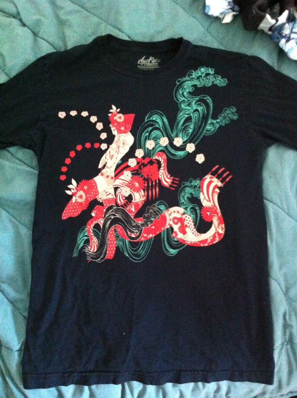 Lay your t-shirt flat, facing up. It's ok if your shirt isn't this cool; the technique will still work