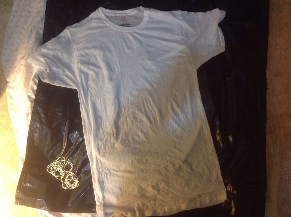 Lay your t-shirt flat over the tarp.