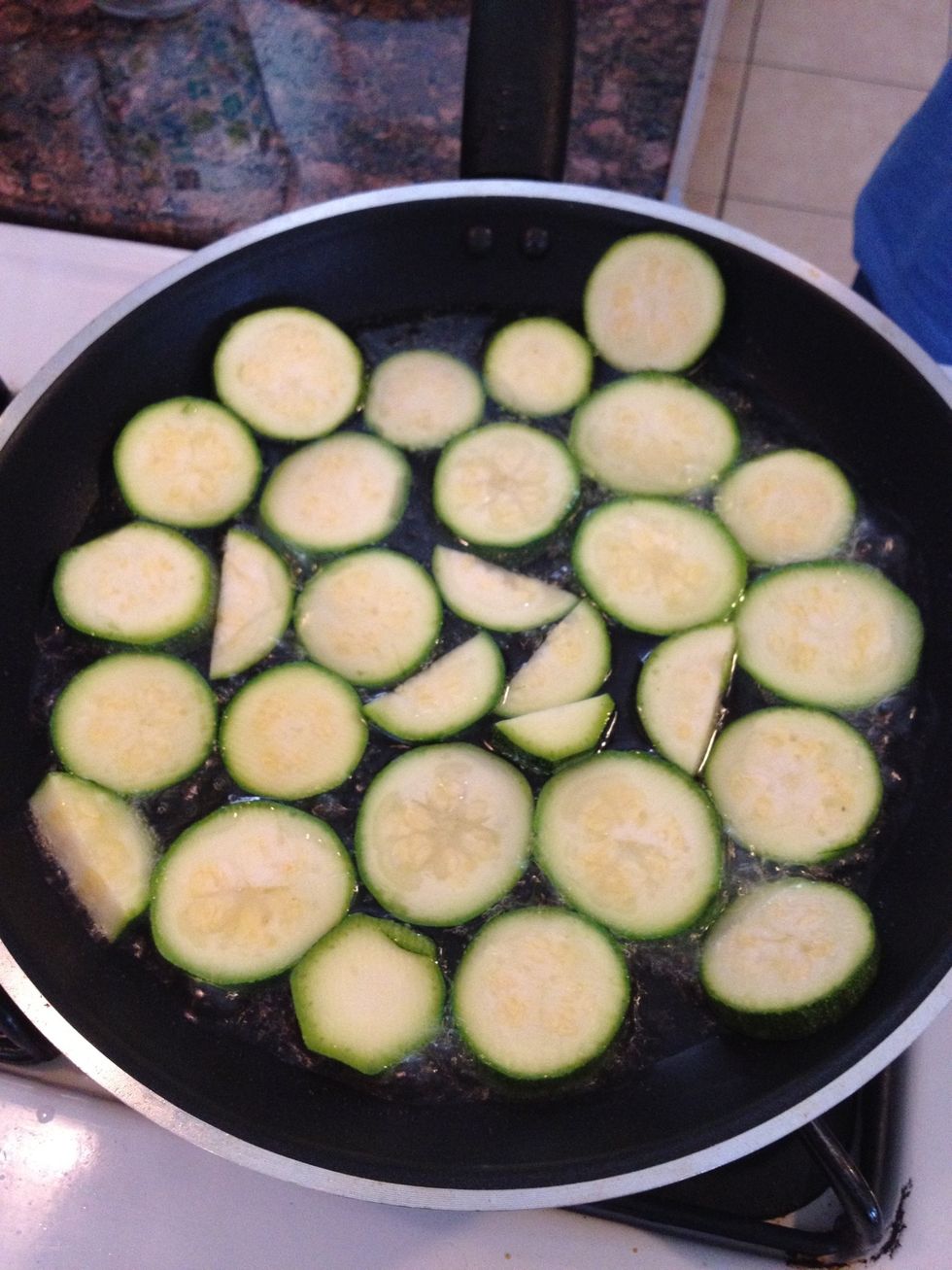 Lay zucchini flat in the oil
