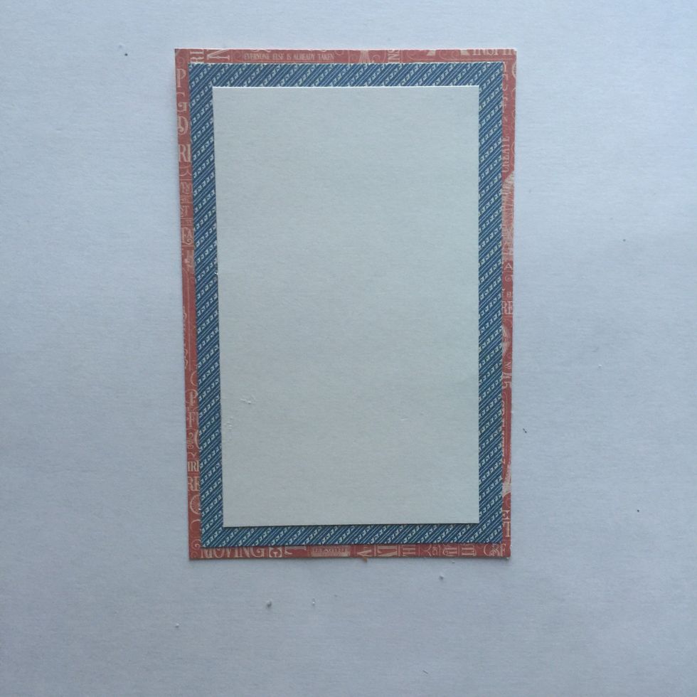 Layer a 3 5/8"x 5 5/8" blue patterned sheet from the 6x6 pad.