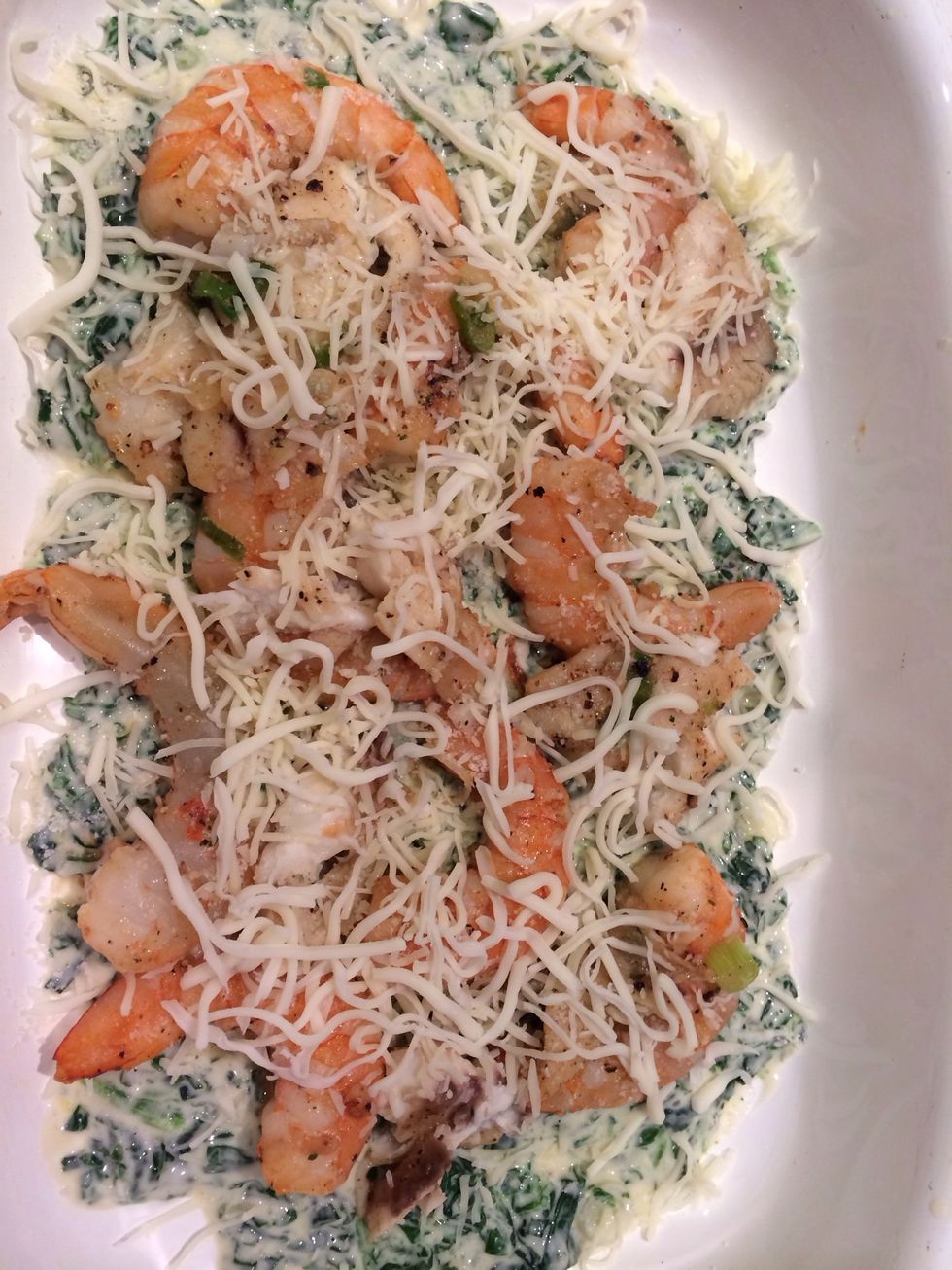 layer alfredo sauce and spinach mixture..( thin layer) layer shrimp next then tilapia..cover with thin layer of cheese