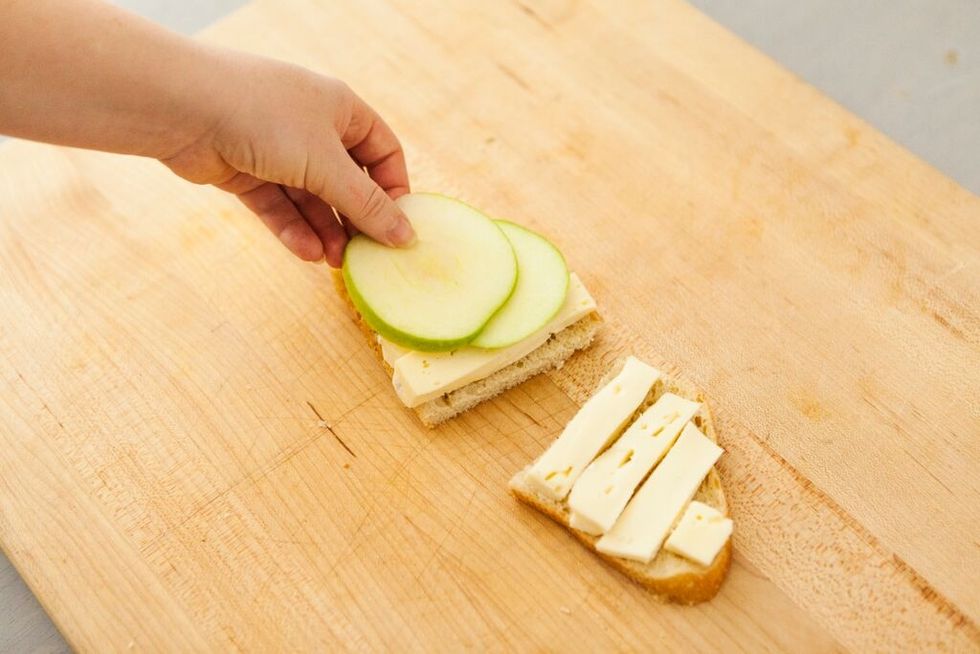 Layer apple slices over the brie.