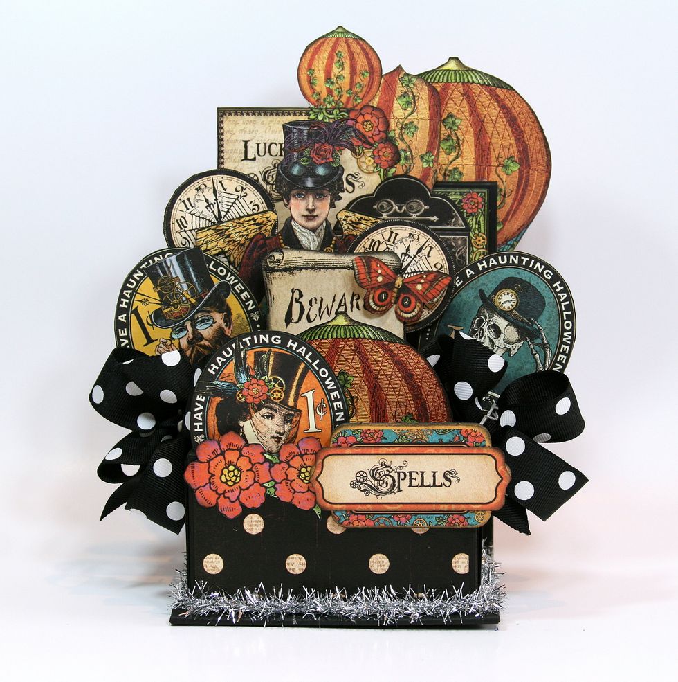 Layer chipboard images and secure on front of box.