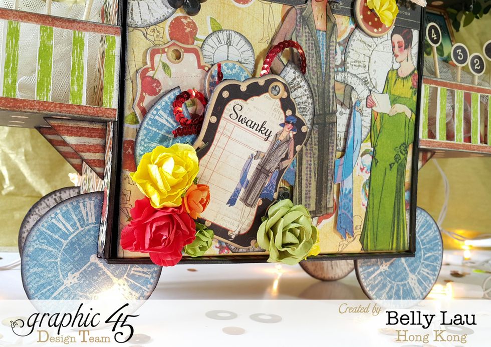 Layer chipboard pieces and paper flowers in the front of the album.