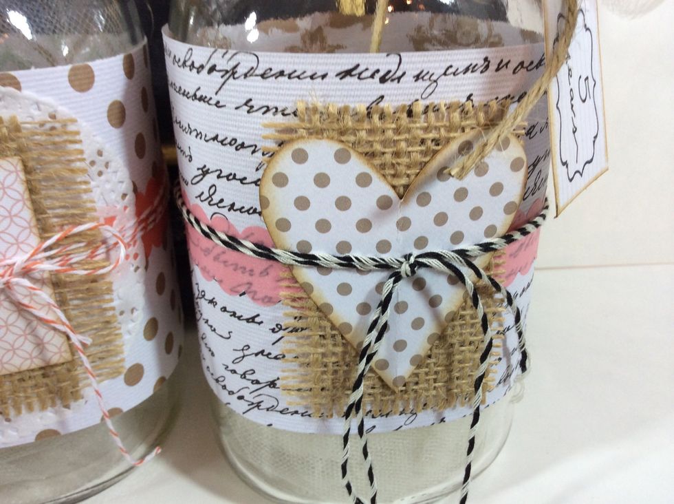 Layer cut shapes and 'save the date' cut aparts with burlap to embellish jars. Tie with Baker's twine, jute or ribbon.