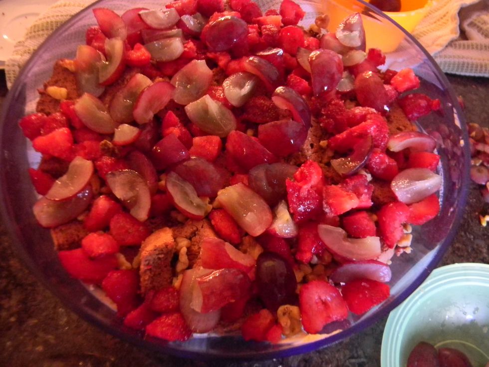 Layer everything in a large decorative bowl starting with the cream, then adding the sliced cake, sprinkle the nuts and then the fruit. Keep  layering everything until you get to the top of the bowl.