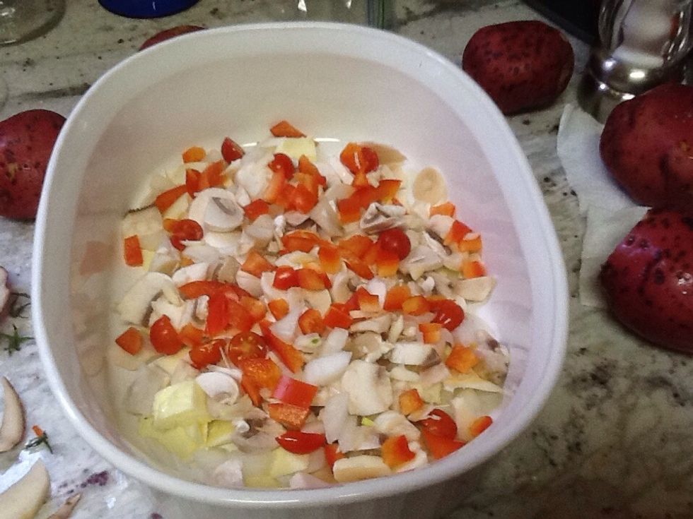 Layer in baking dish: half stick butter cut up, diced red pepper, sliced onion, sliced mushroom, chopped garlic clove, sliced tomatoes. Use 1/2 to 1 cup of each veggie, based on your preference.