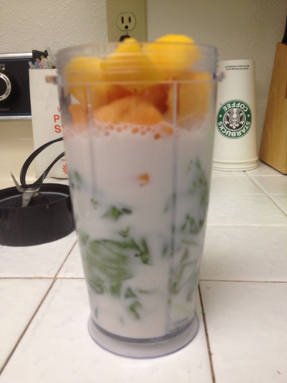 Layer in cup like so. Spinach first, then frozen fruit, and pour your liquid over the top. Add protein powder if you choose too.