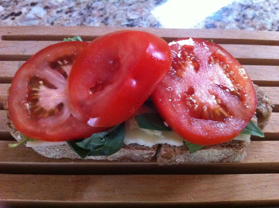 Layer on tomato slices and sprinkle with salt and pepper.