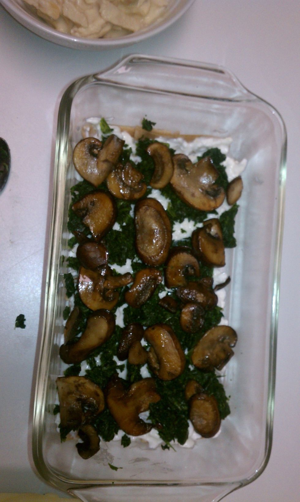 Layer spinach and mushrooms