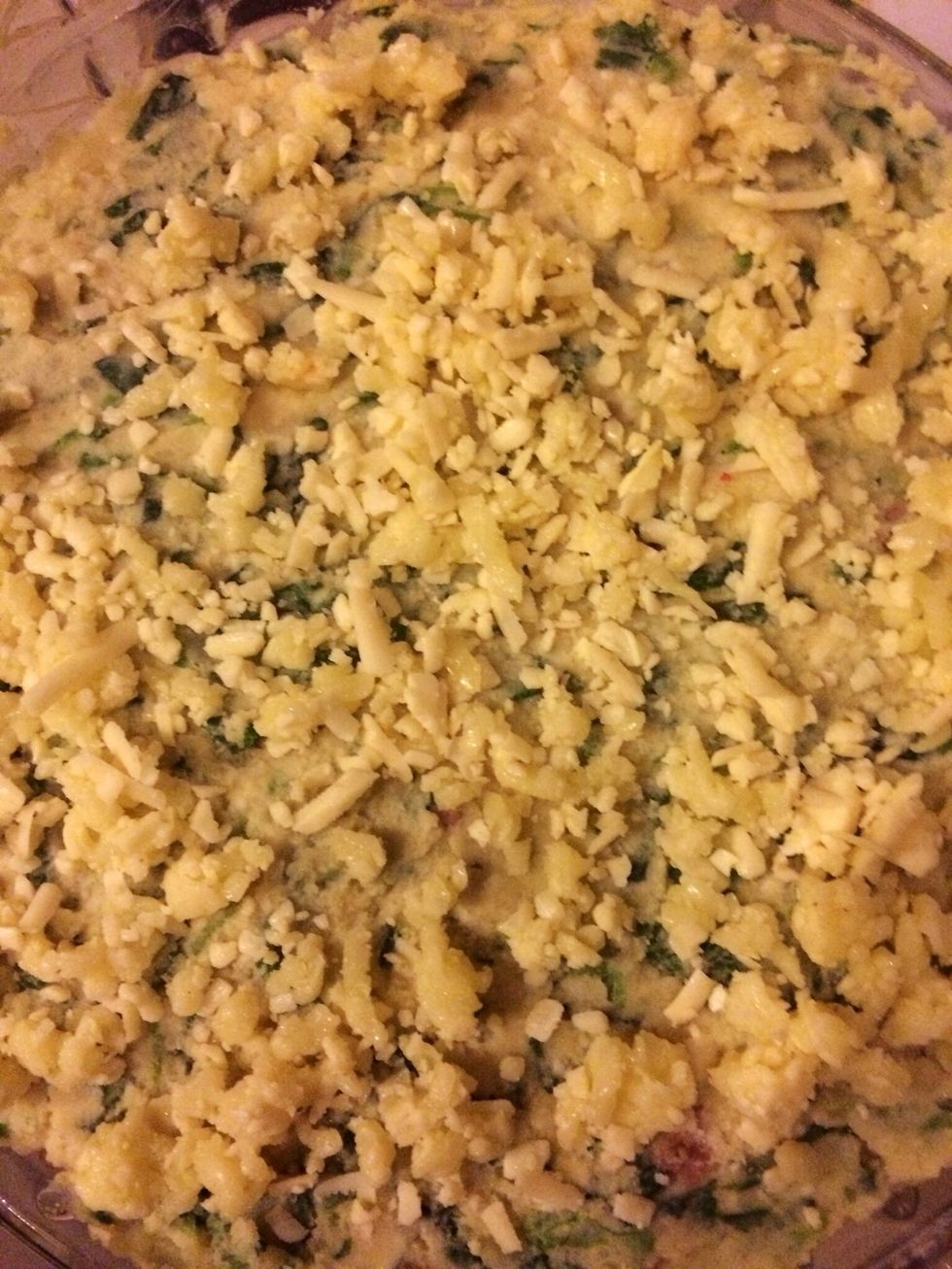 Layer the baking dish with butter/margarine, and the on the other bowl mix all cheeses, fried sausages, and spinach all together- add salt and pepper, and put all Together in the baking dish.