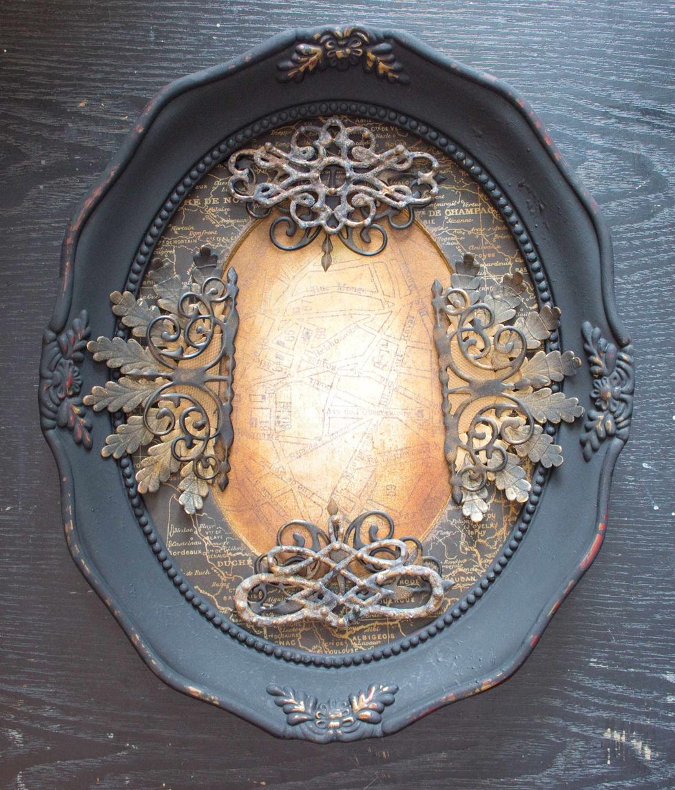 Layer the die cuts over and under Dresden Trim "Gold Rosette" and your Faux Wrought Iron pieces, and play with your design choices. Set embellishments aside for now: