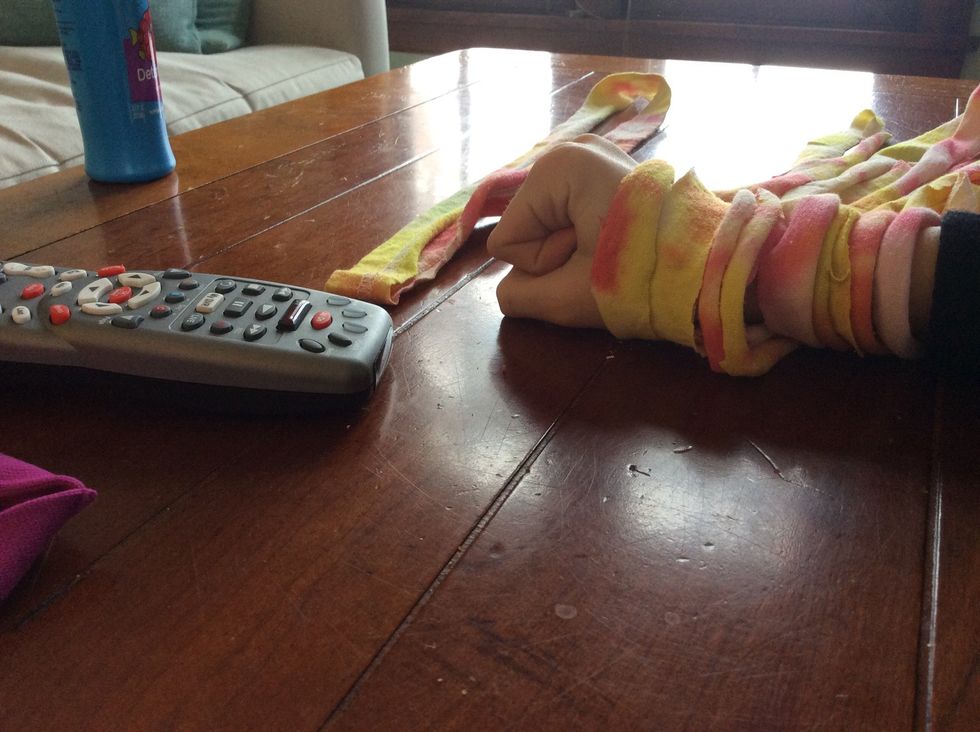 Layer the loops of fabric together, but leave of out.