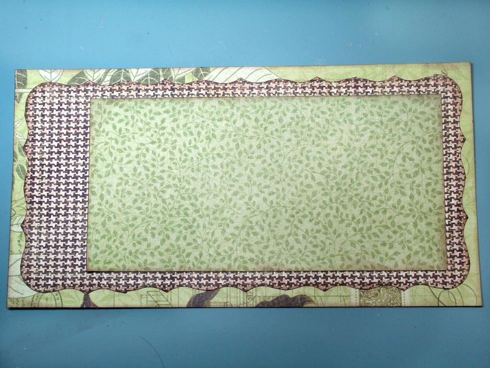 Layer the smaller green piece over the houndstooth check using the opposite side of the paper and adhering 3/4" from the right side.