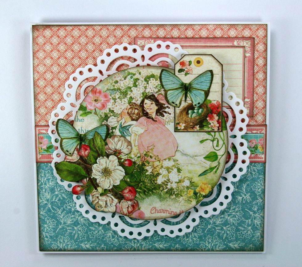 Layer the tag with nest image topped off with an additional butterfly to the top right corner of the image.