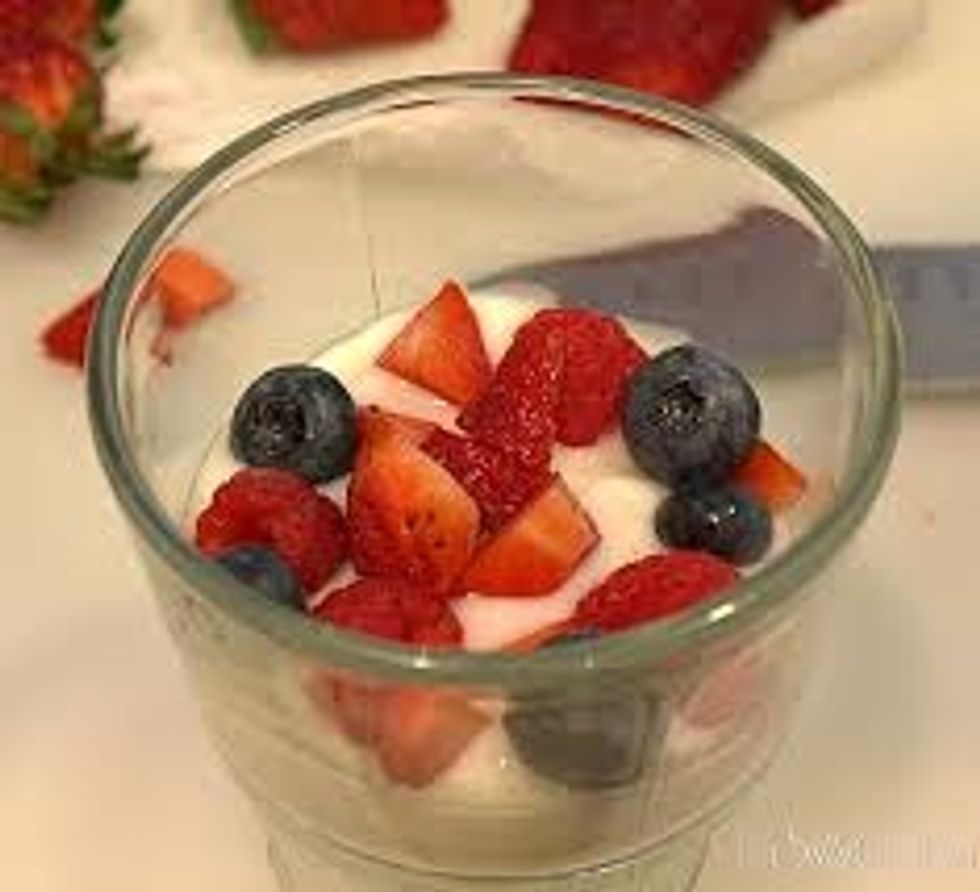 layer the yogurt with 1/3 of your strawberries, blueberries, and blackberries