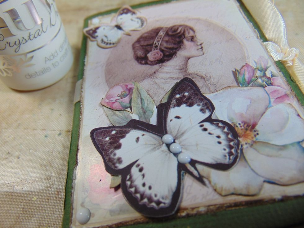 .... layer these up. Add some 3D paint dots on the butterfly and the album corners.