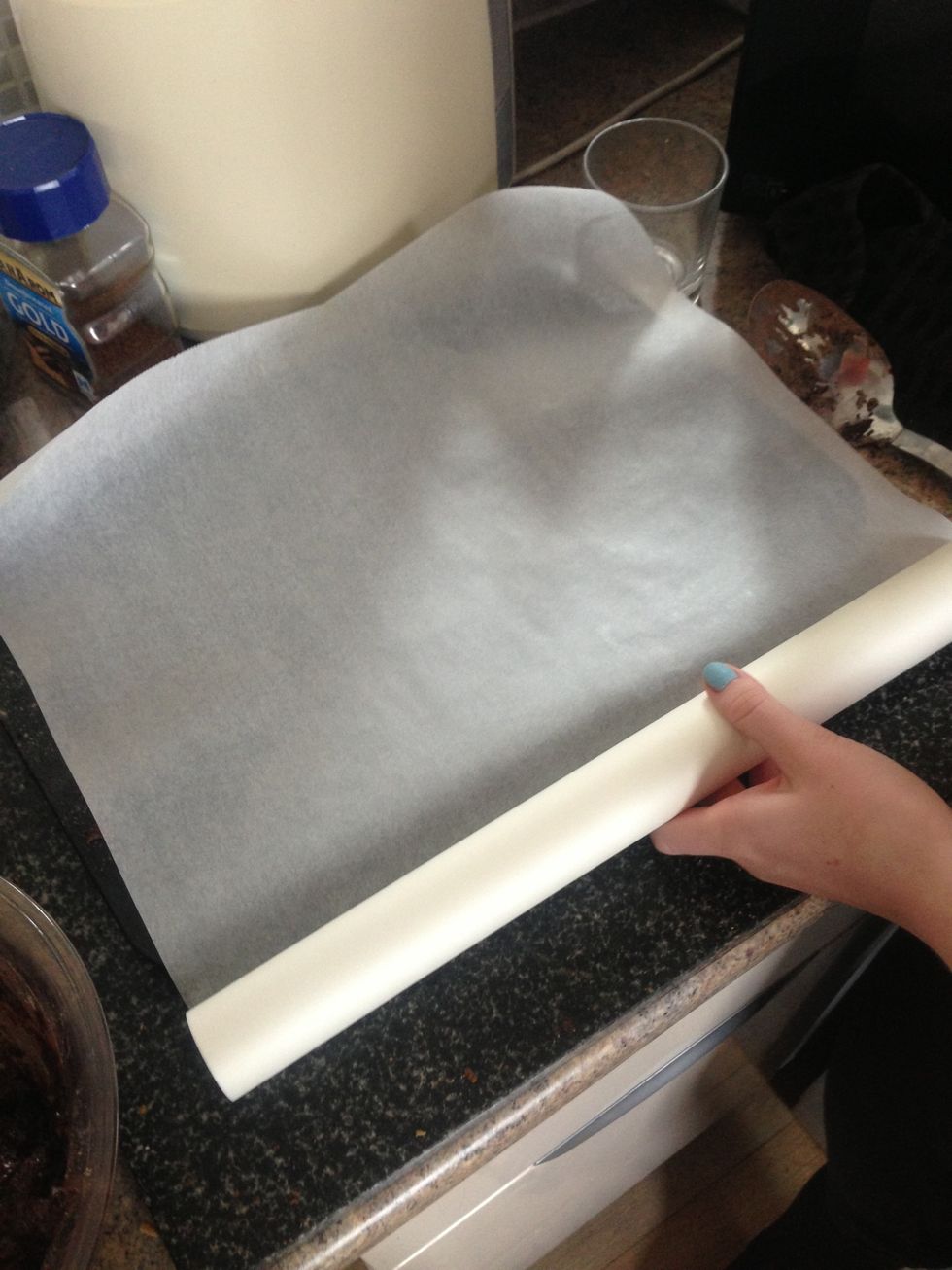 Layout grease proof paper into a baking tray