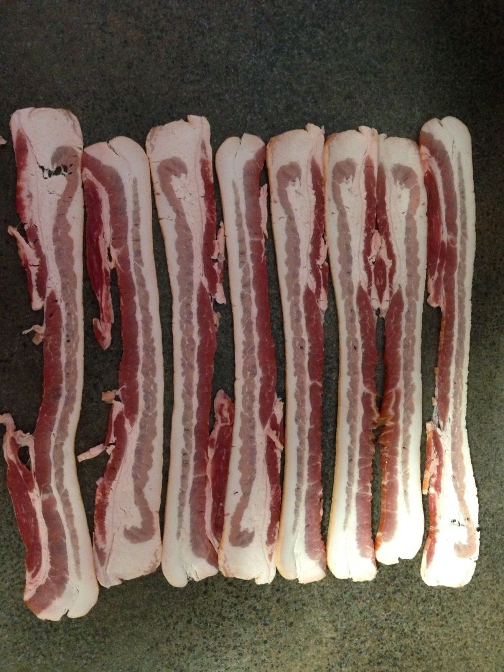 Layout several strips of bacon.