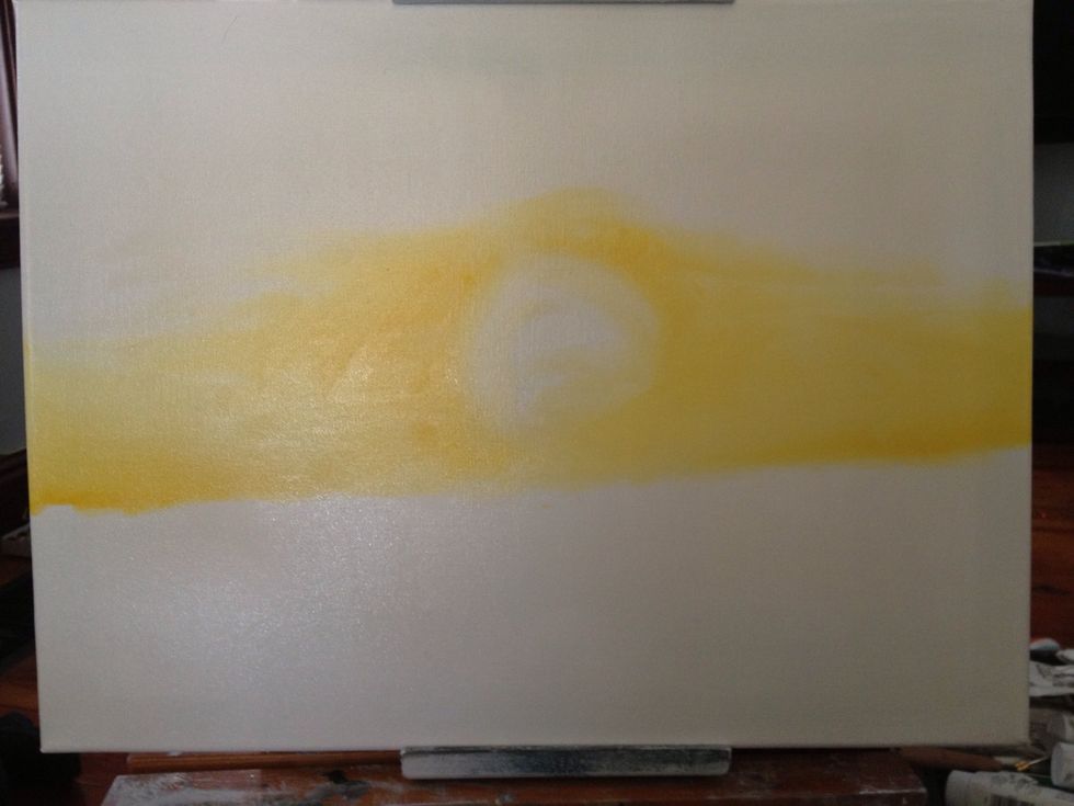 Leave a circle for what will be your setting sun. Finish the golden yellow until you are satisfied with where it ends.