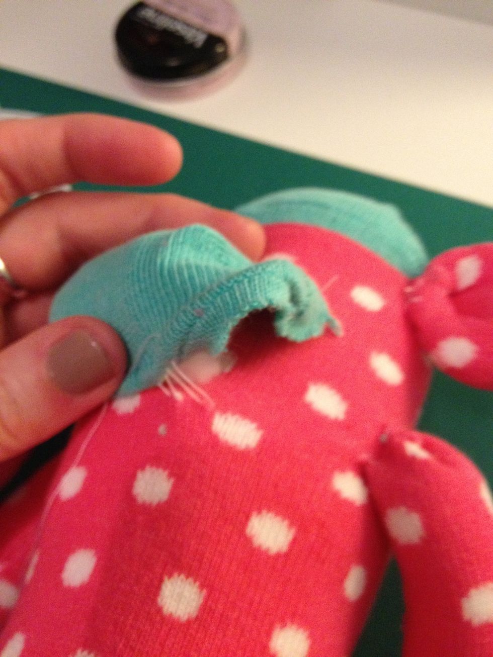 Leave a gap whilst sewing the mouth and stuff with cotton wool.