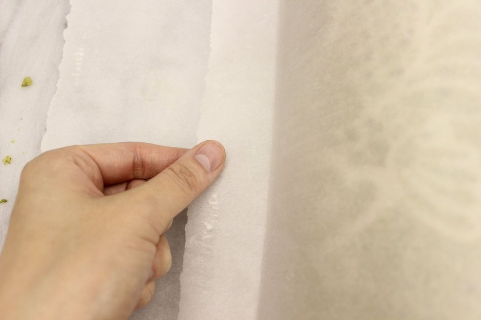 Leave a little 3 cm tab untucked.