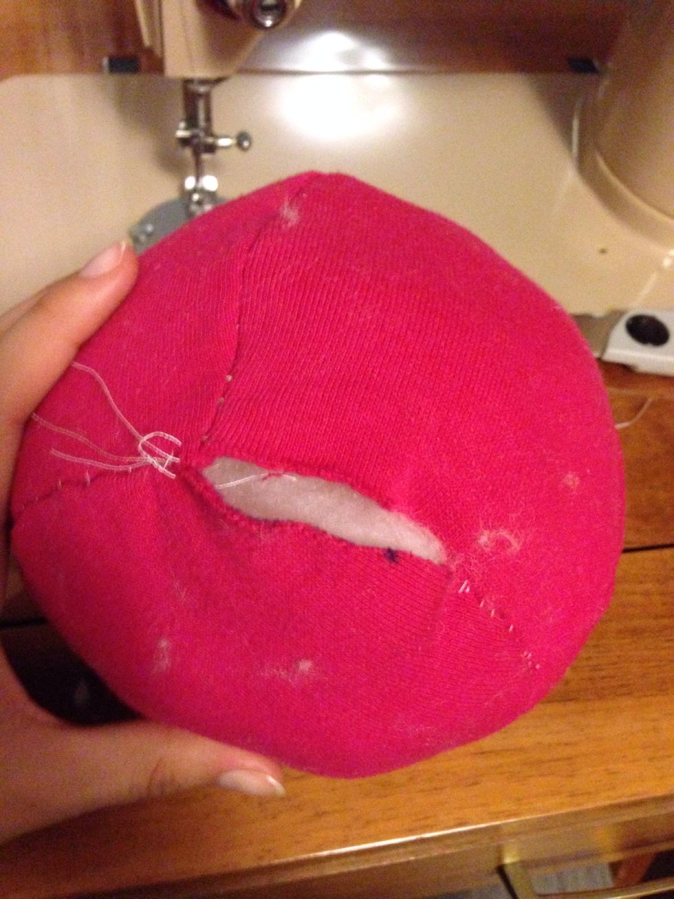 Leave a small gap and evert the inside out :) put Cotten inside and close the hole