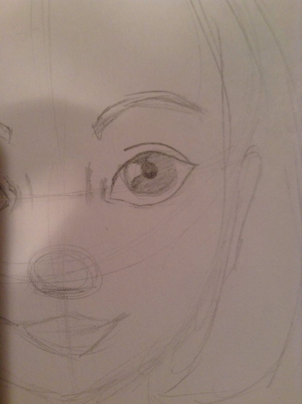 Leave a square to the left of the pupil white for a highlight. Shade the rest of the iris, gradually making some parts darker.