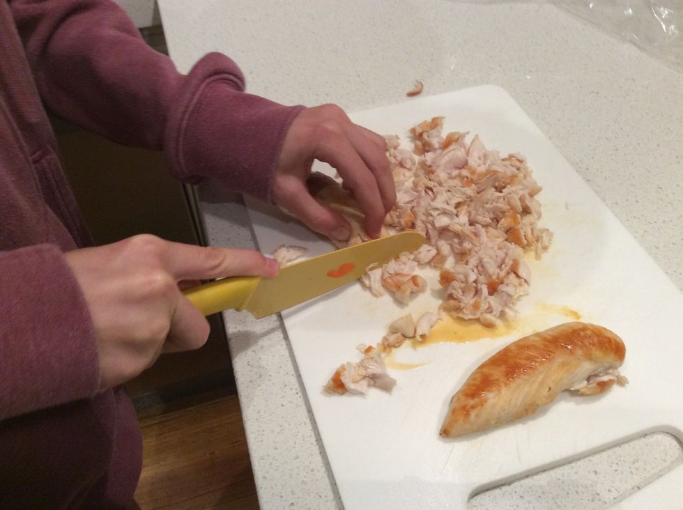 Leave chicken to cool then cut it into small pieces