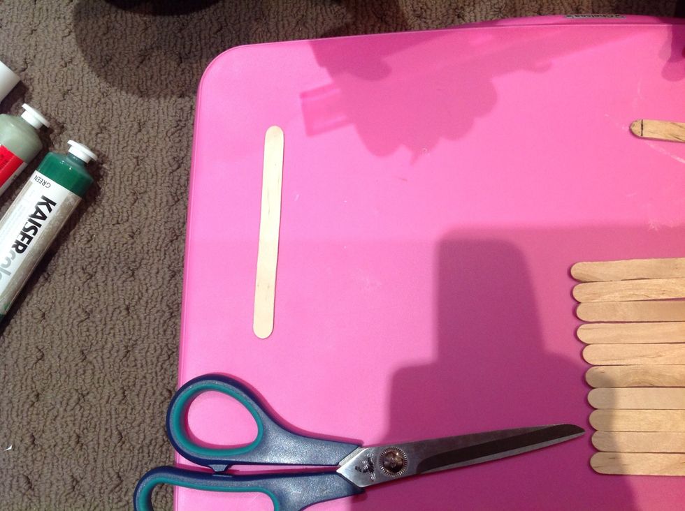 Leave one pop stick aside. This will be used as the backing.