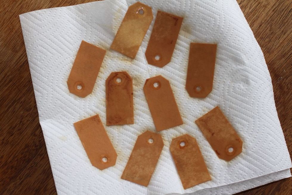 Leave tags in the tea until they reach the color you are striving for. Remove and let dry completely on paper towels.