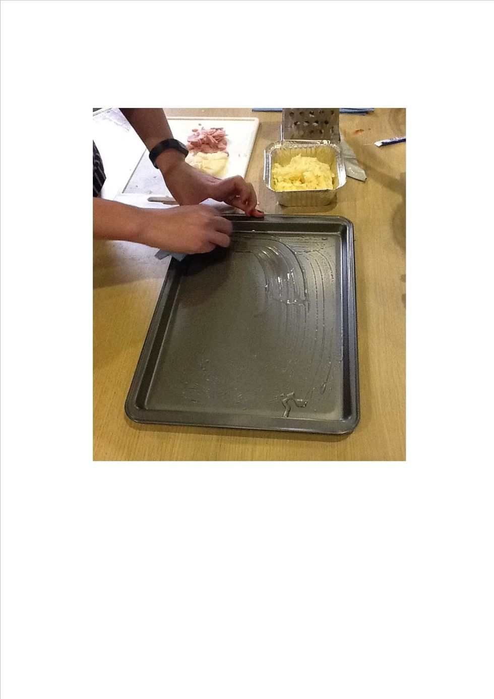 Leave the dough to prove for around 25 minutes - while the dough is proving, preheat the oven to 200C/gas mark 6. Lightly brush the baking tray with oil.
