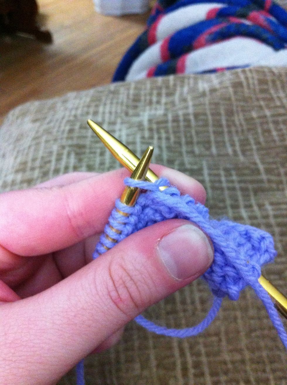 Leave the new purled stitch on the left needle.